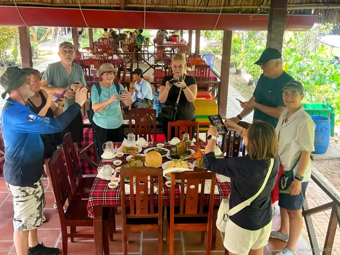 Motorboat cruise on the Tien River during the Cu Chi Tunnels and Mekong Delta tour